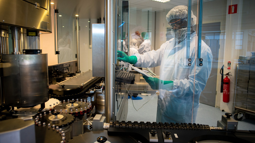 BBIO-man looking at medical machine