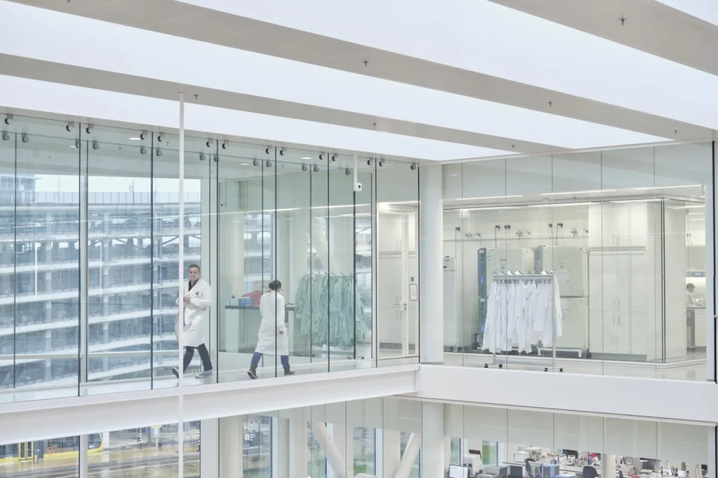 Gemmab - people walking in lab