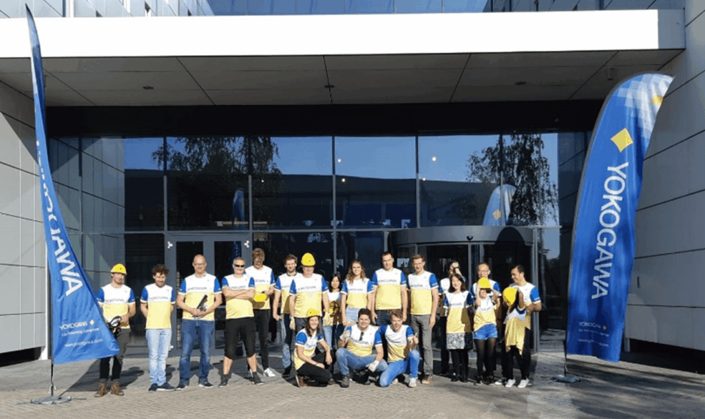 Yokagawa people in front of building