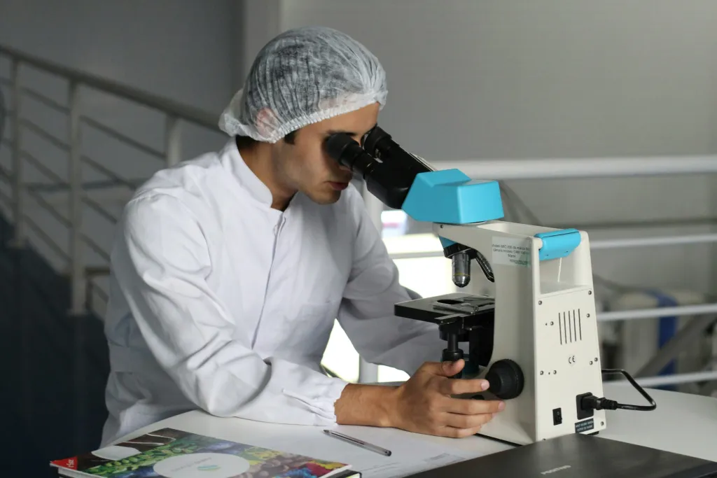 Man looking at microscope